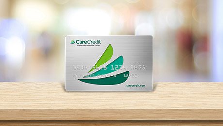 Care Credit card on light wood table