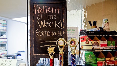 Refreshment area with chalkboard that says patient of the week Ramona H