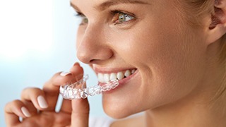 The Colony orthodontics lady fitting clear aligner