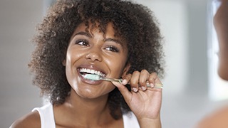 Woman brushing teeth