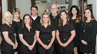 The Colony Dental Services Ridgepointe Dental Team smiling