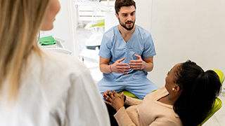 woman talking to cosmetic dentist in The Colony   