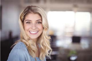 Closeup of woman with dental crowns in The Colony smiling