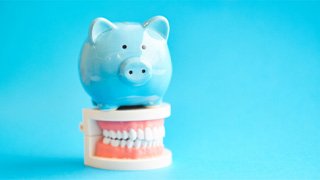 piggy bank cost of dentures in The Colony 
    