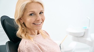 Woman smiling in the dental chair