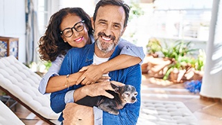 a man smiling with dentures happily with his family