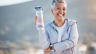 a woman from The Colony smiling with her new dentures