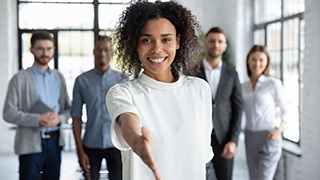 a woman in The Colony smiling in a professional setting