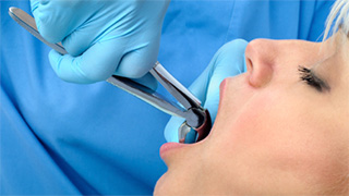 Patient having tooth extracted