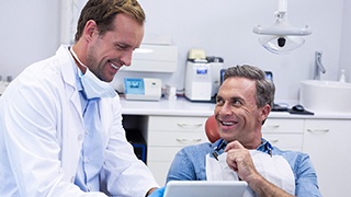 Man smiling at a dentist in The Colony