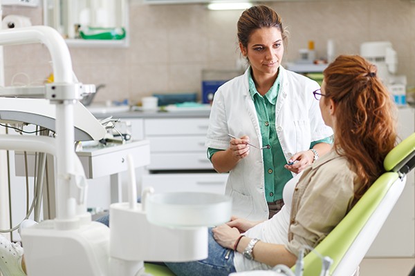 patient speaks with dentist