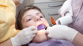 little boy getting dental sealants