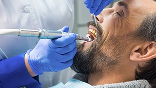 Relaxed man in dental chair during restorative treatment