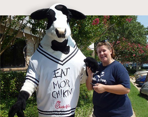 Ridgepointe Dental team member next to Chick Fil A mascot