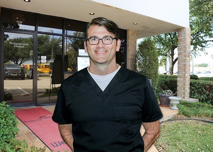 The Colony Texas dentist Doctor Austin Amos in front of Ridgepointe Dental