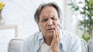 man with jaw pain