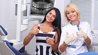 woman happy at dentist