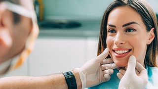 dentist checking out a patient’s smile