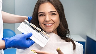 Patient gesturing at a shade guide