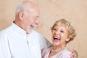 older couple embracing and smiling