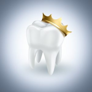 white tooth with golden crown