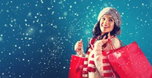 woman smiling for holidays red bags