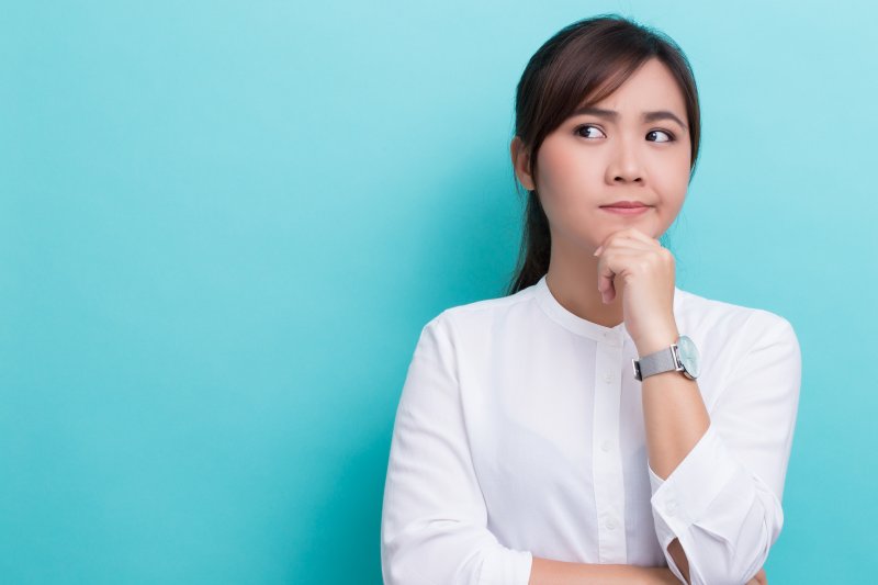 a woman with a pensive expression 