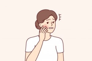 illustration of woman experiencing facial pain 