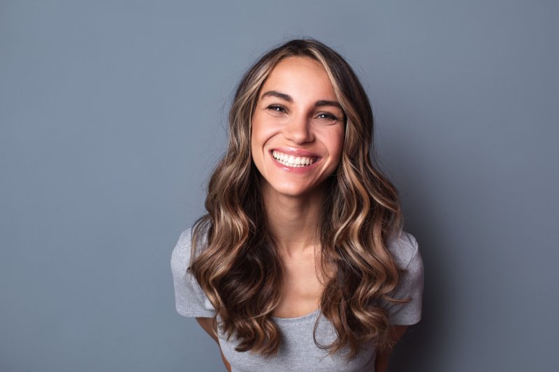 a person with dental implants smiling