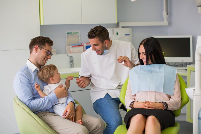 A whole family visiting with their local family dentist