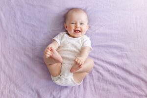 Happy, smiling baby viewed from above