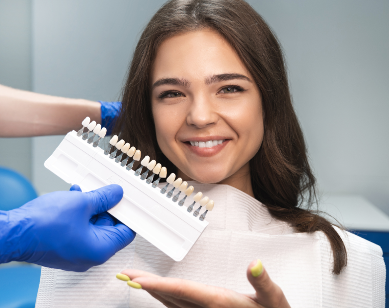 Patient holding hand out to show veneer options